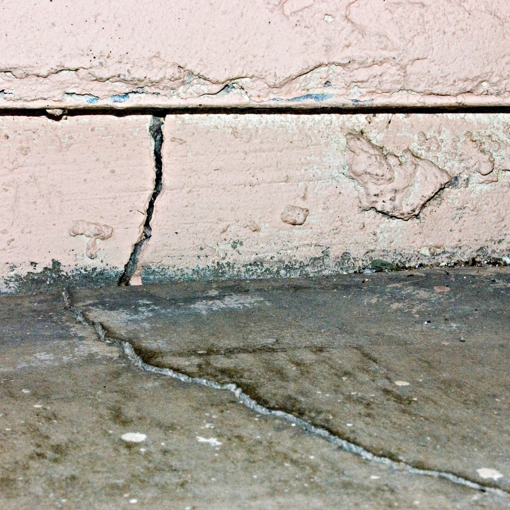 Crack where an exterior concrete wall meets a slab