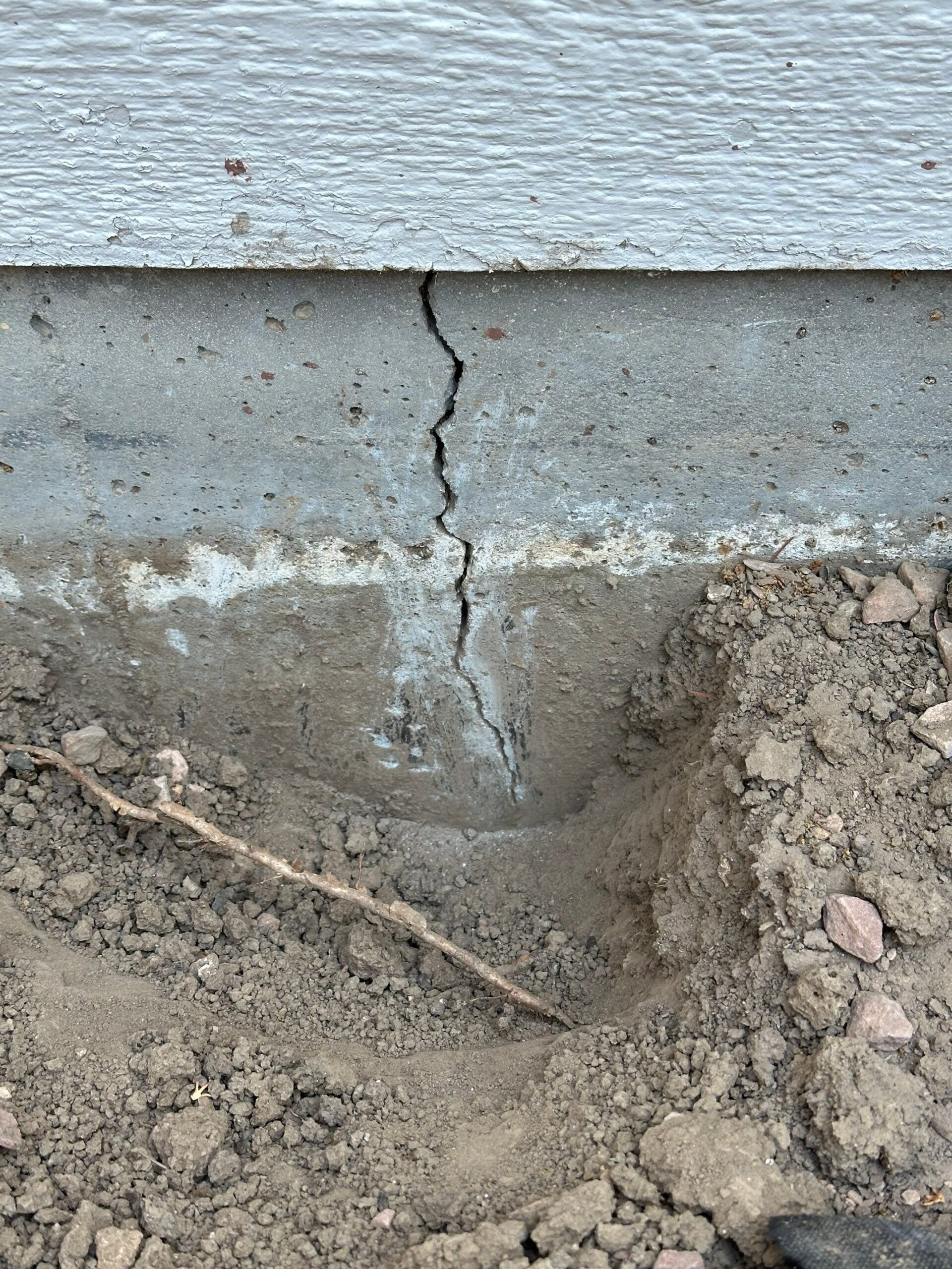 Vertical crack in an exterior concrete foundation