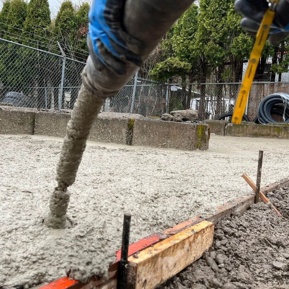 Concrete being poured for foundation work